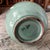 This vintage Korean celadon vase features a delicate crackle glaze and elegant crane motif. Measuring 6"x4", it embodies...