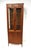 An exceptional oiled walnut tall curio display cabinet with double glass doors and glass surround, two adjustable glass...