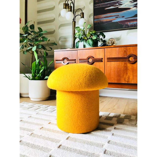 A handmade mushroom shaped ottoman, upholstered in "Saffron" yellow wool fabric. Perfect for using as a footstool or extra...
