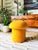 A handmade mushroom shaped ottoman, upholstered in "Saffron" yellow wool fabric. Perfect for using as a footstool or extra...