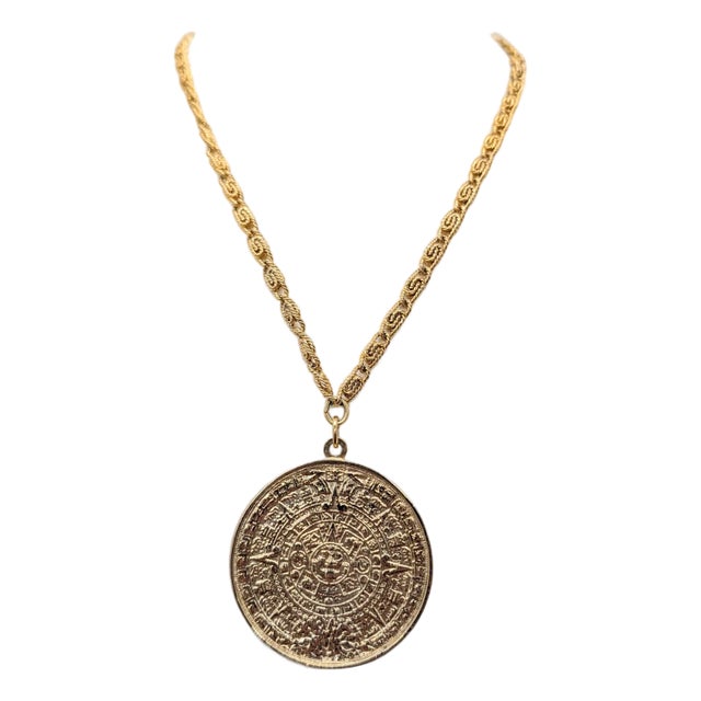 Vintage 1970s Signed Napier Goldtone Aztec Inspired Round Pendant Necklace For Sale