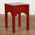 A vintage Chinese side table from the Mid-20th Century, with red lacquer, single drawer, carved spandrels and horse hoof...
