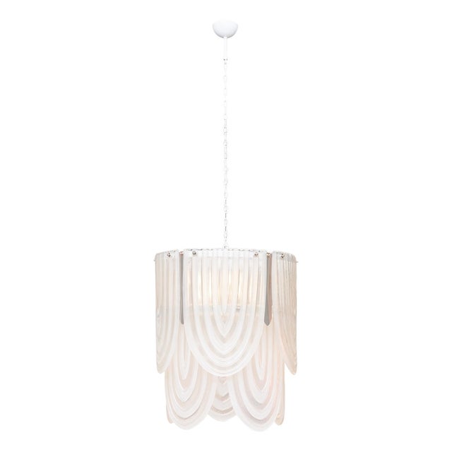 Chandelier from Murano, Italy outside of Venice. This fixture features hand-blown and molded glass pieces in a white...