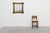 This large square giltwood mirror exemplifies the Baroque revival style of the 20th century, with its deeply carved...