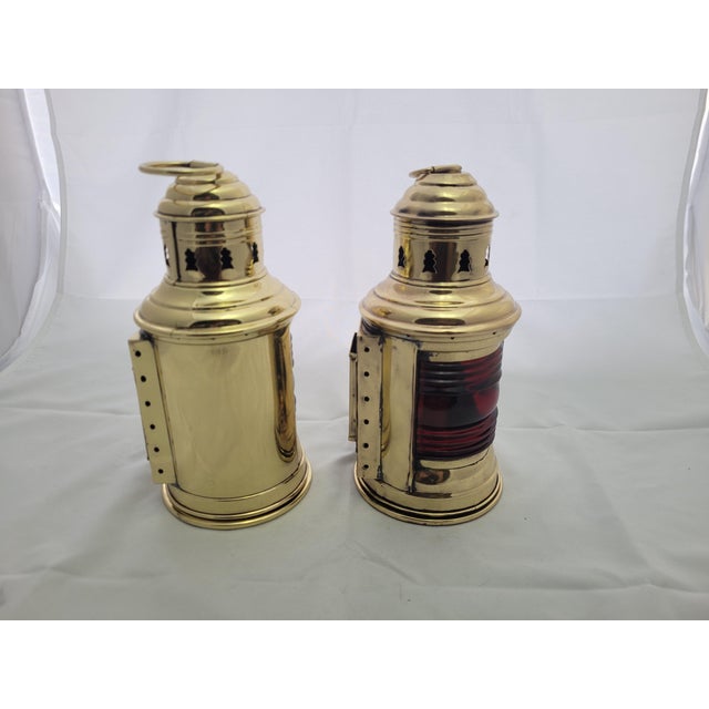 Pair of yacht lanterns with red and green Fresnel glass lenses. The brass has been meticulously polished and lacquered....