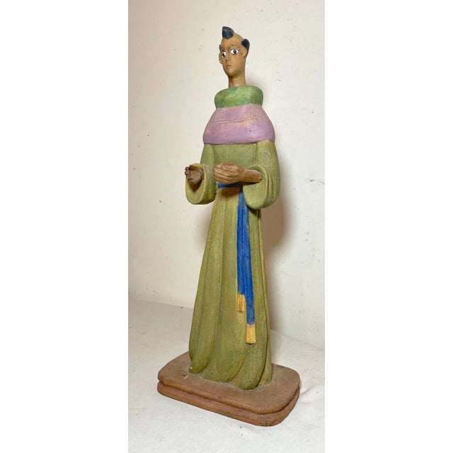 Up for sale is a wonderful vintage hand carved religious wooden Folk Art saint sculpture. It's carved with exquisite...