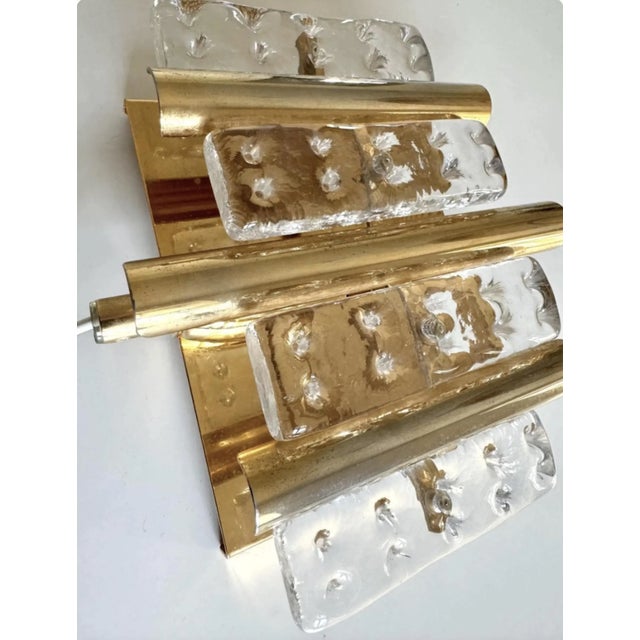 A glamorous, vintage Swedish crystal wall light (sconce) in the style of Hans-Agne Jakobsson for Orrefors, dating from the...