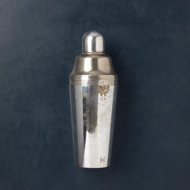 Vintage 1930's Napier "Dial A Drink" silver plated cocktail shaker. The outer sleeve turns to reveal 15 various cocktail...