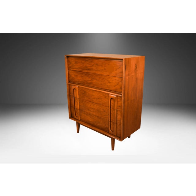 Absolutely stunning Mid-Century Modern Highboy dresser designed by Lane Furniture in the United States circa 1960's. This...