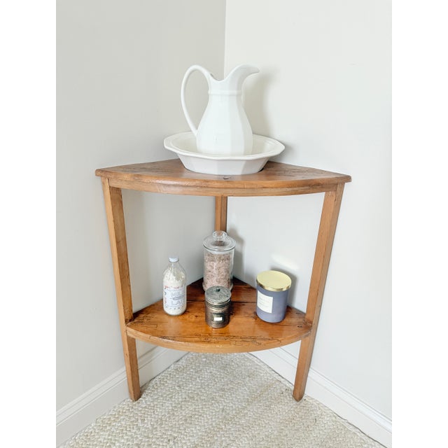 An antique English pine corner wash basin is a delightful and practical relic from the 18th or 19th century, designed to...