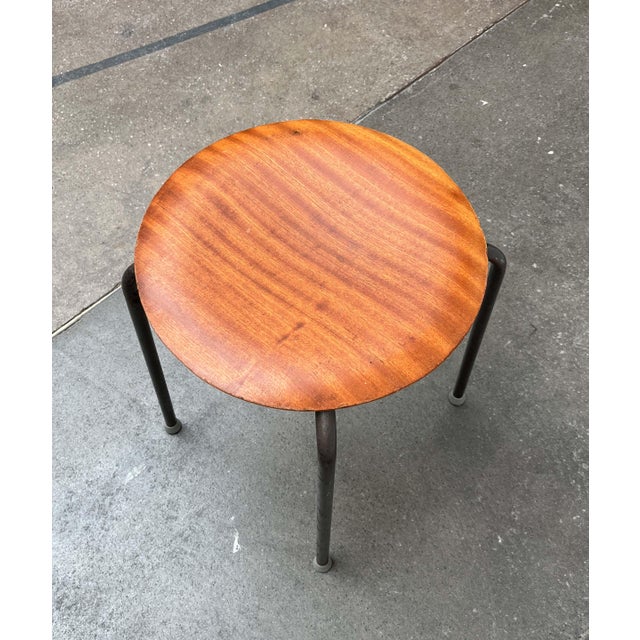 A simple stool made in Denmark. Similar to the Dot Stool by Arne Jacobsen. Functional design. A wooden seat on a sturdy...
