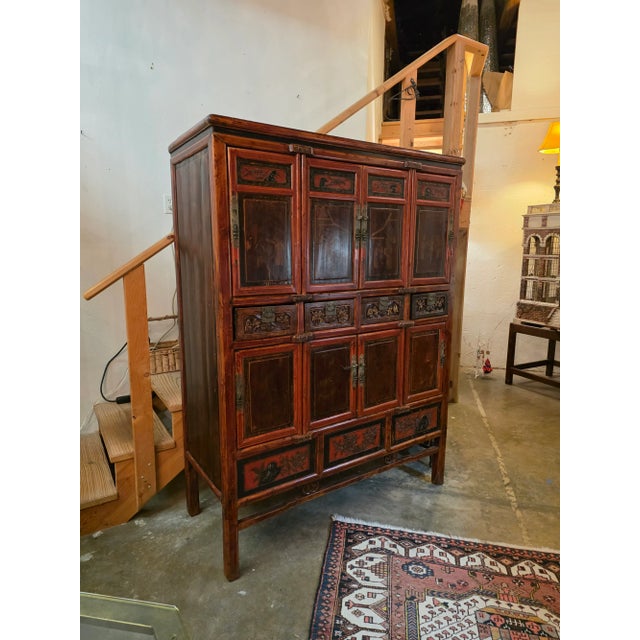 This has wonderful details and lots of carved wood doors and storage chambers. It may have been a kitchen piece.