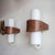 Elegant geometric sconces composed of opaque glass cylinders with a teak veneer wrap, wired for US standards, dimmable,...