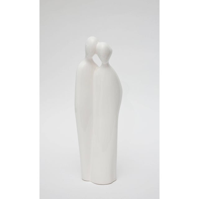 This tall vintage sculpture/object of an abstract couple; man/woman is white to off-white porcelain by Rosenthal Netter....