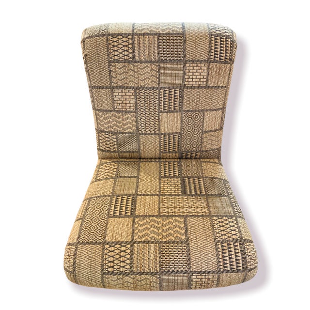 Armless slipper chairs with front rollers. Newley reupholstered in tribal patchwork fabric.