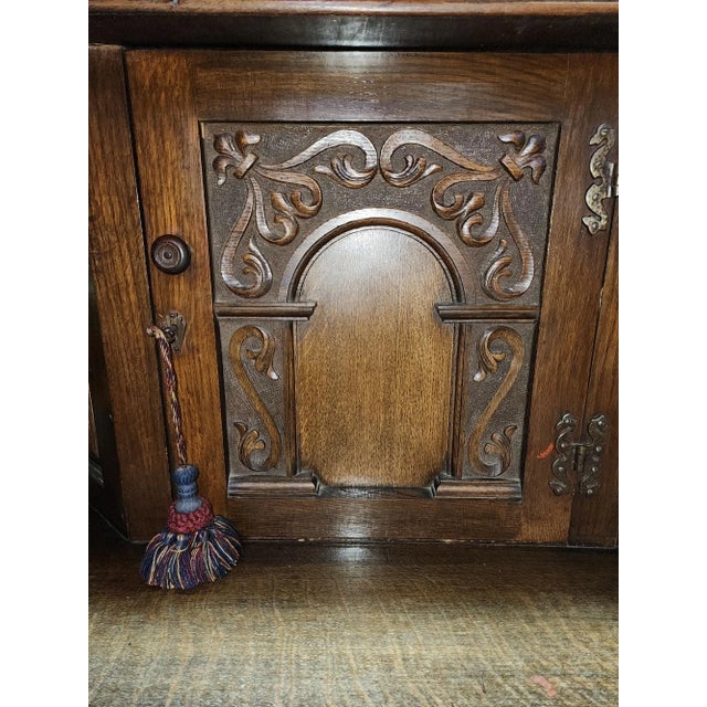 Stunning 19th century solid oak court cupboard in the Jacobean style. Ornately carved, with large carved central cabinet,...