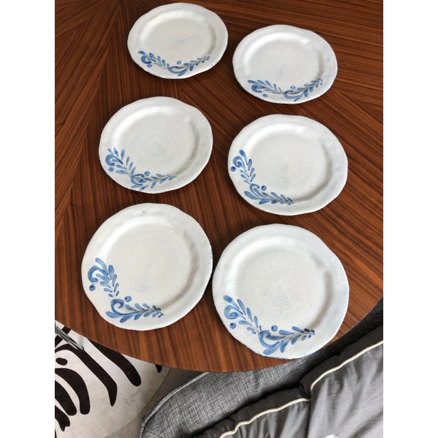 Beautiful handmade and hand-painted Italian folk pottery plates with a gorgeous blue floral leaf design. Each piece is a...