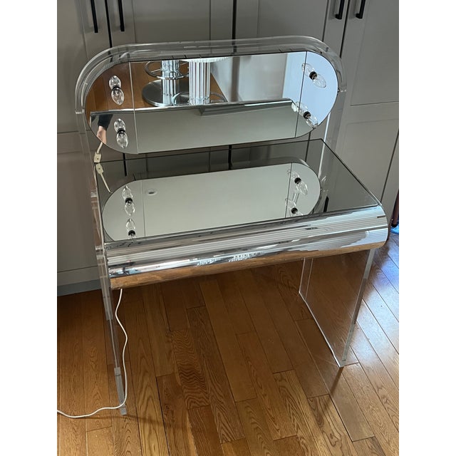 1970 lucite vanity desk with chrome panels details. Normal wear and missing a few chrome details. Please check all of the...
