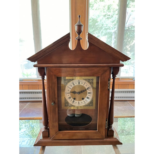 Mantle clock made by Jauch from Western Germany circa 1970-1980. Made from solid Mahogany wood, it exemplifies the...