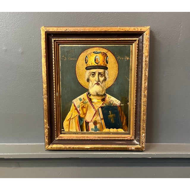 Antique oil painting on board - Russian icon portrait of Saint Nicholas circa 1925. Framed in gilt wood molding. Measures...