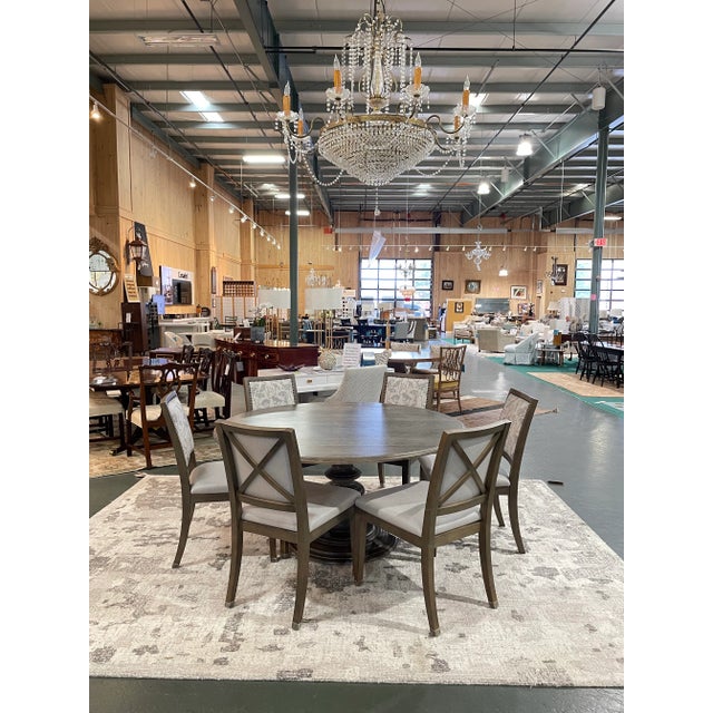 This is a beautiful Bassett Furniture dining set featuring a 60-inch round pedestal table paired with six finely...