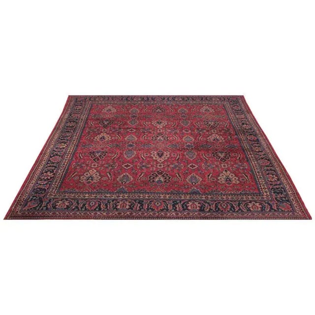 Old handwoven Turkish Sparta rug with a magenta-colored background and navy border, accented with shades of blue, ivory,...