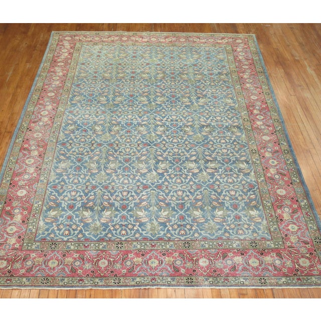 An early 20th-century highly decorative Persian Tabriz rug Measures: 8'2'' x 11'8''