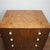 An Art Deco 'Lowboy' chest of drawers. Figured and burr walnut veneered with intricate satinwood and ebonised inlay and...