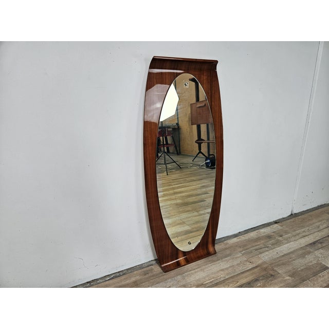 1960s wall mirror by Campo e Graffi with curved, stained plywood frame and a wall-hanging bracket. I have official proof...