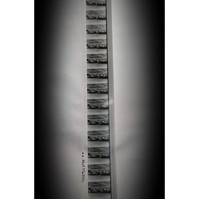 This rare militaria collectible features an old military film housed in its original metal box from the Établissement...