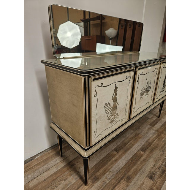 An elegant vintage sideboard/bar cabinet by Umberto Mascagni, dating back to the 1950s, a refined expression of Italian...