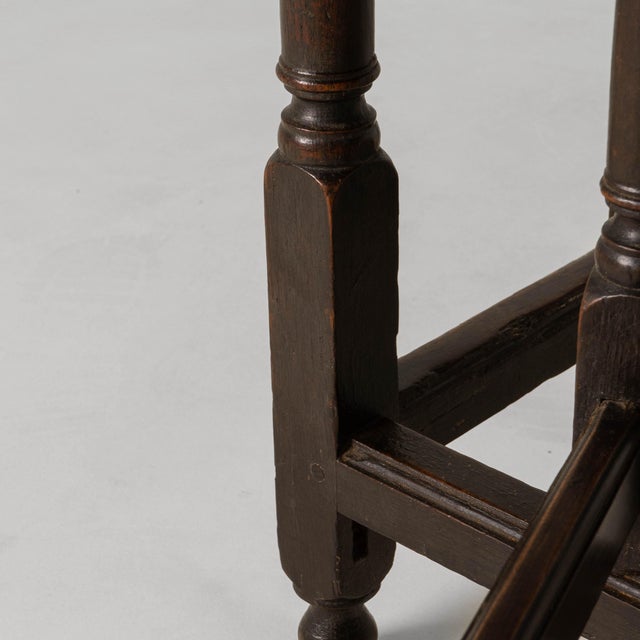 This 1880s French elliptical gateleg table embodies the practical elegance and honest craftsmanship of late 19th-century...