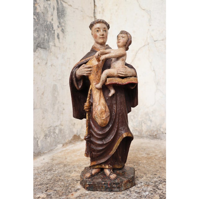 Saint Anthony with the Christ Child, holding a bag for distributing bread to the poor, 18th century, Portuguese Date: 18th...