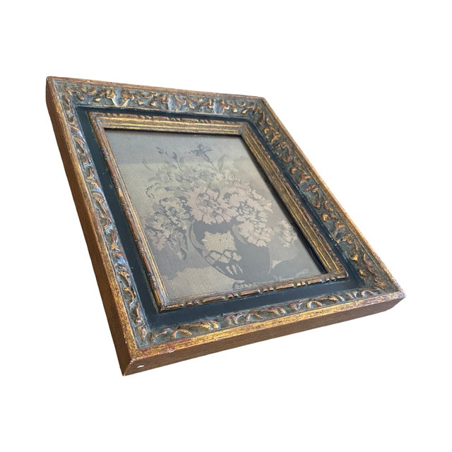 An antique floral tapestry panel presented in an exceptional black and gilt frame with remarkable depth and decorative...