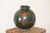This is a beautiful Raku vase in a deep green color, decorated with a simple red cross, giving it a bit of a gothic feel....