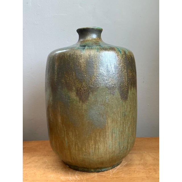 This vintage handcrafted studio pottery vase exemplifies the refined artistry and organic aesthetic that defined mid-...