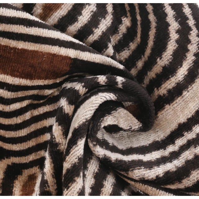 "Make a bold statement in your home with this handmade silk velvet throw pillow, featuring a striking geometric design in...