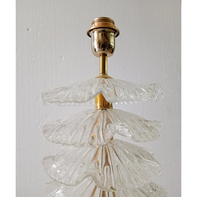 A very particular and original Murano lamp, a series of round glass leaves arranged one above the other, of a transparent...