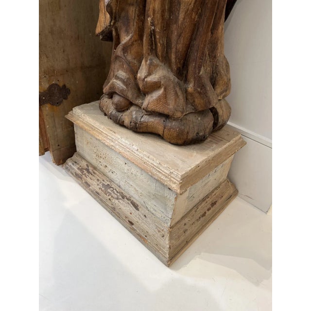 Carved from a single log with lovely details. Sits on a pedestal 21 W X 16 Deep X 11 H