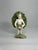 This porcelain figurine stands 4.25" tall with a base approximately 2" wide. The piece is in very fine condition, with...