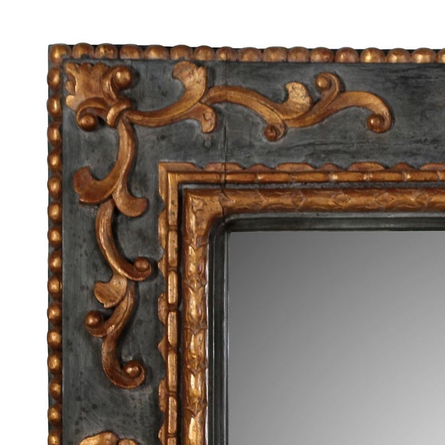 Elegant and richly detailed, this Italian mirror features a hand-painted charcoal gray frame accented with parcel gilt...