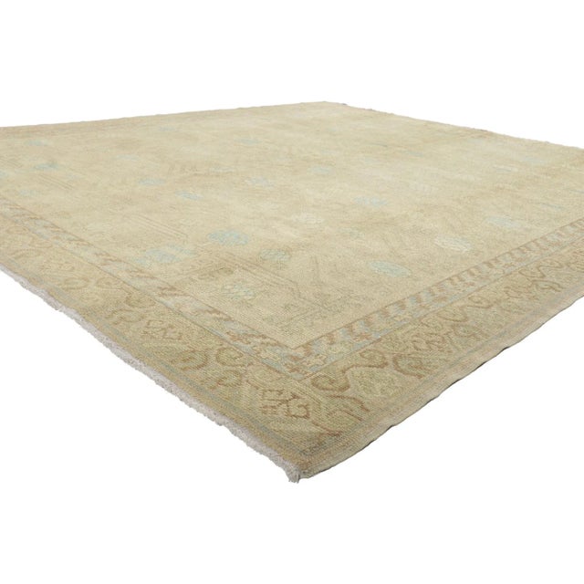 51624 Soft Earth-Tone Turkish Khotan Rug, 08'06 x 09'07. Emanating timeless style with incredible detail and texture, this...