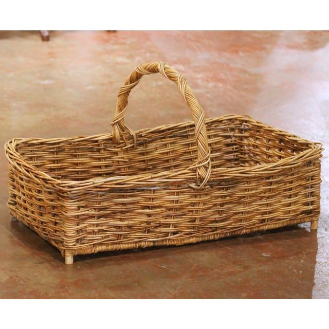Decorate a kitchen, garden room, laundry room, or covered patio with this charming antique wicker market basket. Crafted...