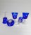 Set of 5 Cobalt blue stemmed cut to clear wine crystal. Grapes, stars, and fan cut motif. Excellent condition of 4 One has...