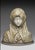 Libero GREMIGNI. Marble and alabaster sculpture depicting a bust of the Virgin Mary on an oval gray marble plinth, with a...