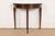 A gorgeous Federal or Hepplewhite style flip top demilune console game table In the manner of Baker Furniture USA, Circa...