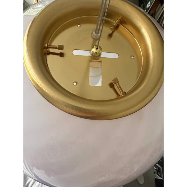 Impressive contemporary milky- white blowing Murano Glass Sphere with a swirl of pink rods . Design in very particular and...