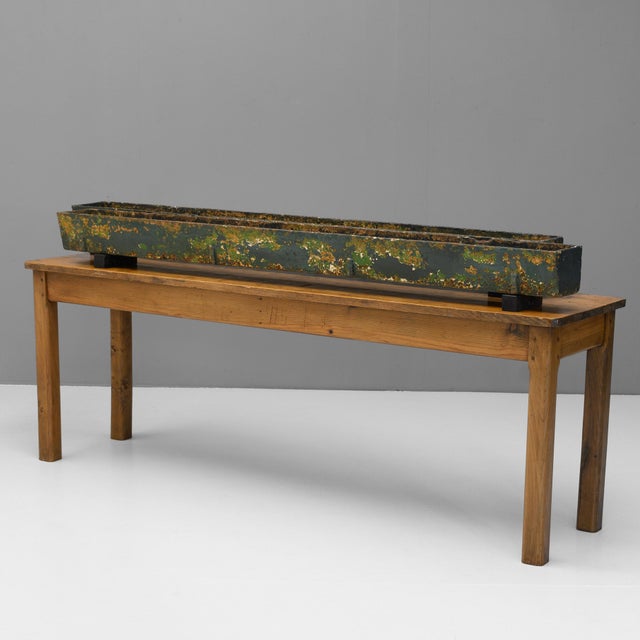 Pair of cast iron planters / troughs in aged paint finish. Circa 1900.