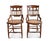 A pair of antique Victorian Eastlake style cane seat chairs. The antique cane chairs feature ornate back rests, turned...