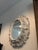 An exquisite reproduction in caste resin Italian Rococo- style mirror featuring flowing acanthus leaves, grape clusters,...